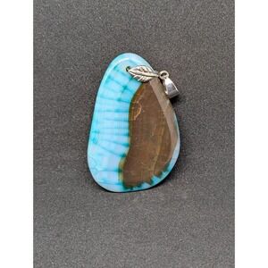Fire Agate Pendant 
Approximately 2 and 1/2 by‎ 1 and 1/2